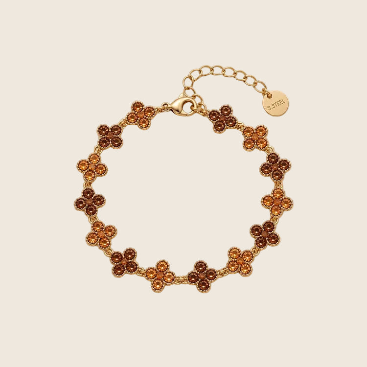 Crystal Bloom Armband aus 14k vergoldetem Edelstahl mit Kleeblatt-Motiven aus warmen, bernsteinfarbenen Zirkonia-Steinen.