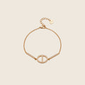 Dolce Armband in Gold mit ovalem Pavé-Glied, zwei Zirkonia-Stäben und Verlängerungskette