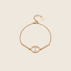 Dolce Armband in Gold mit ovalem Pavé-Glied, zwei Zirkonia-Stäben und Verlängerungskette