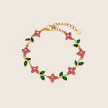 Gardenia Armband aus 14k vergoldetem Edelstahl mit rosa Zirkonia-Blüten und grünen Blättern