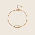 Maribel Armband in Gold mit länglichem Pavé-Glied, zwei Zirkonia-Steinen und Verlängerungskette